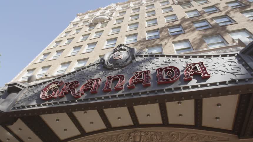 View of a building awning with the name granada