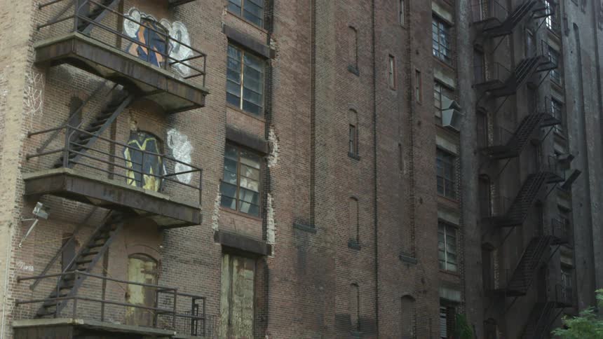 A large building lined with fire escapes