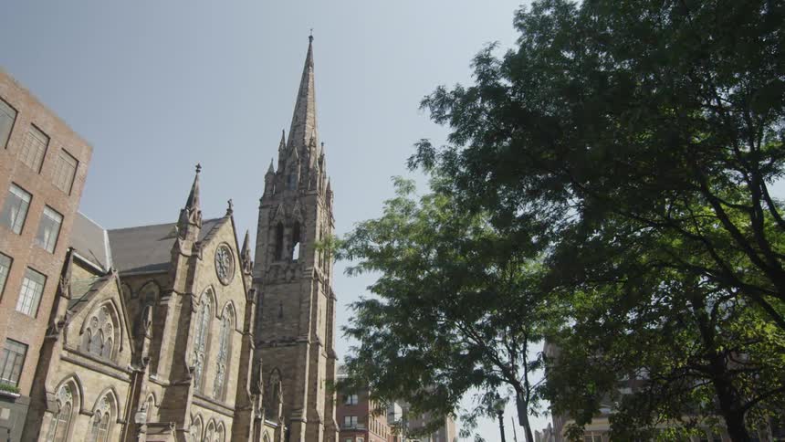 View of buildings and a church steeple on a sunny day
