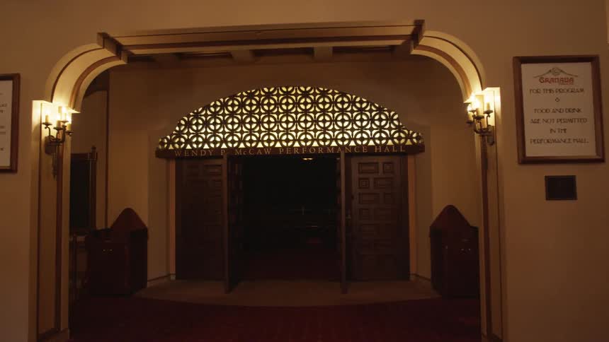 A brightly lit foyer is shown