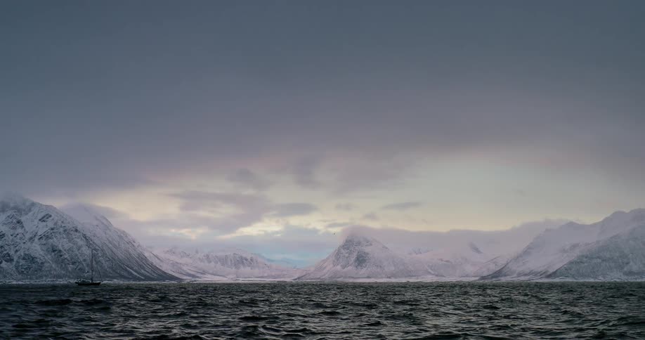 A boat sails on the antarctic waters