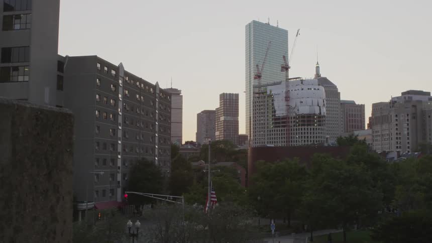 View of a city with trees in front of buildings