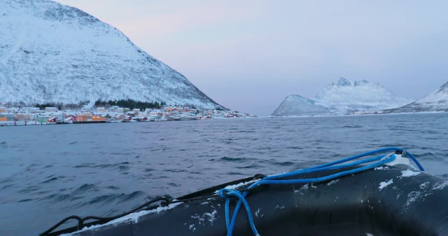 A boat floats on the choppy waters