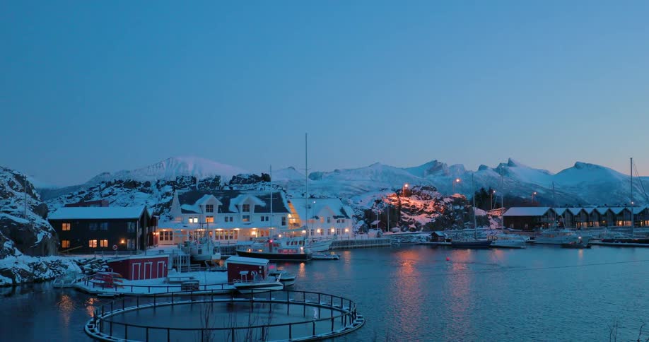 Boats parked in a harbor near many buildings