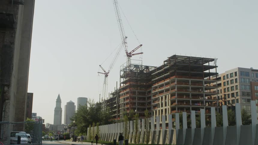 A crane towers over a city