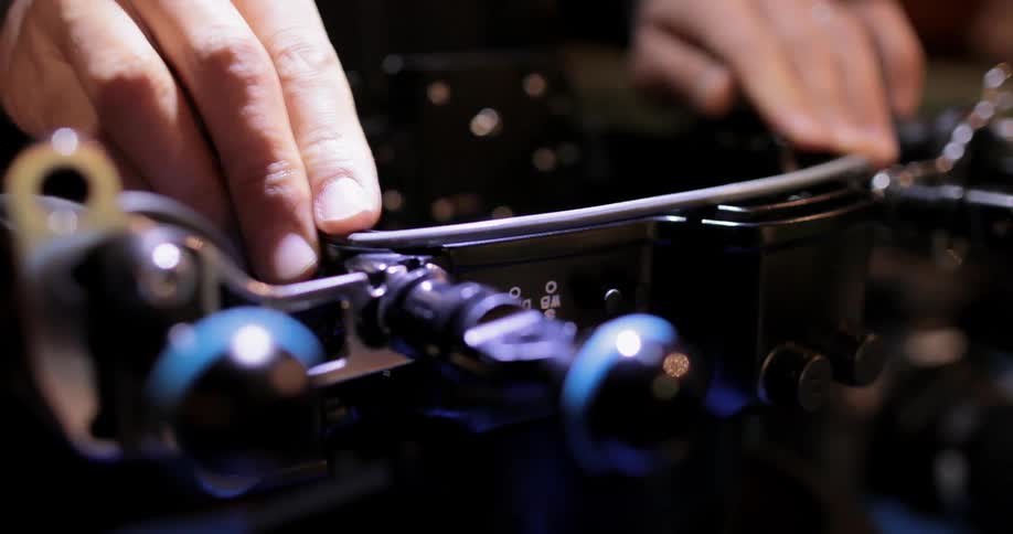 A man is attaching a sealing ring to a camera enclosure