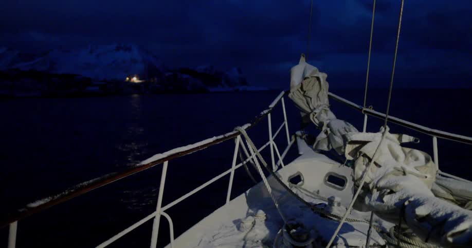 Boat drifting on the sea at night