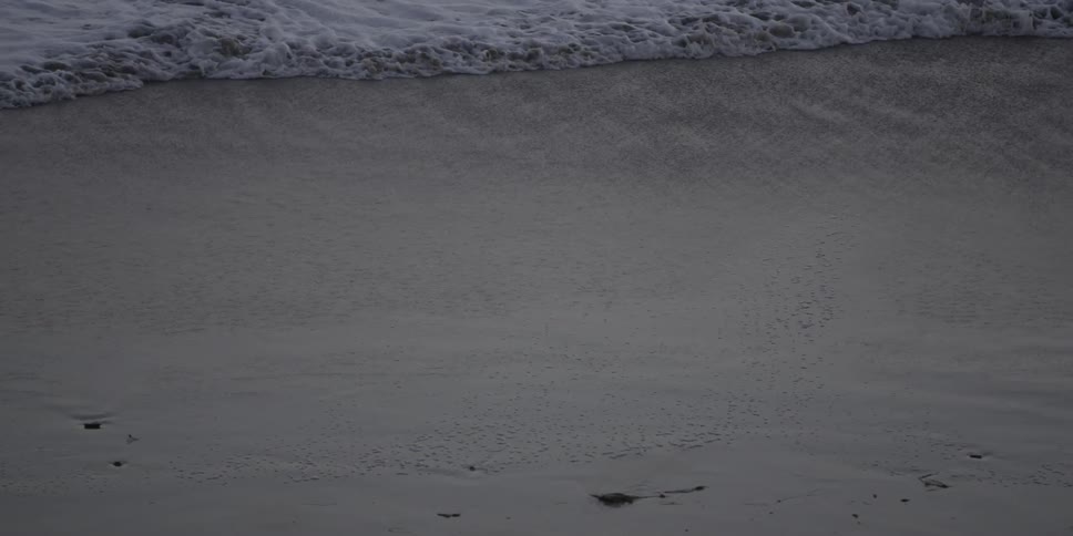 Waves crashing against the beach