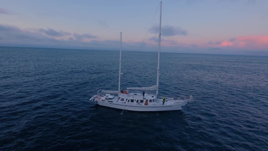 A boat floats on the choppy waters