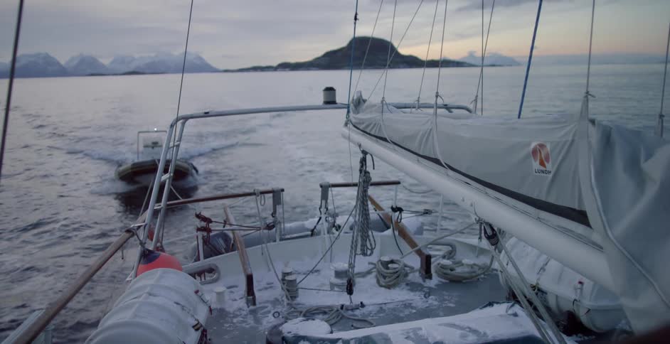 Two boats travel on the water