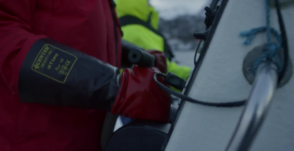 People ride on a small boat in choppy water