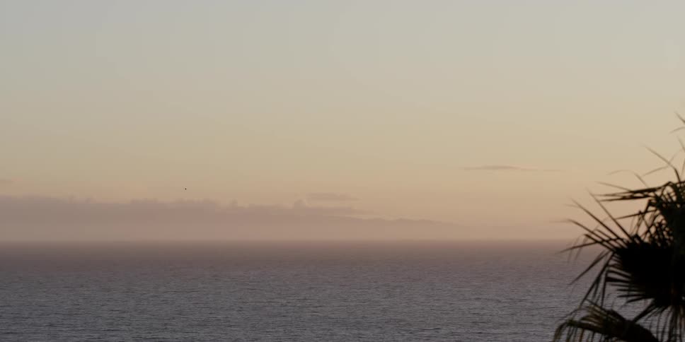 The sun sets on an island