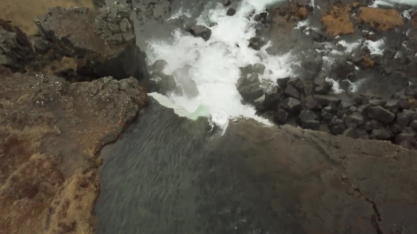 Waterfall tumbles downward