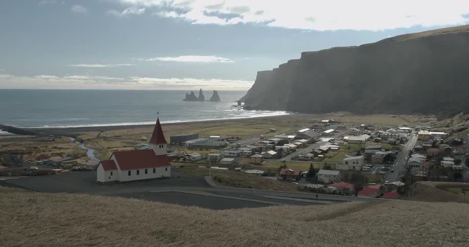 Small village near a large body of water in Iceland