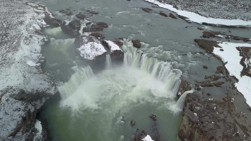Rounded waterfalls flowing as seen from high above