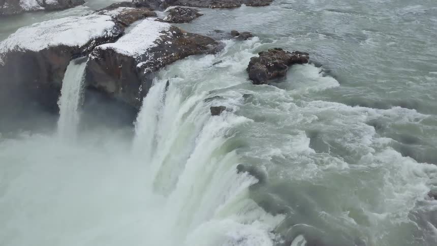 Water falls off the cliff