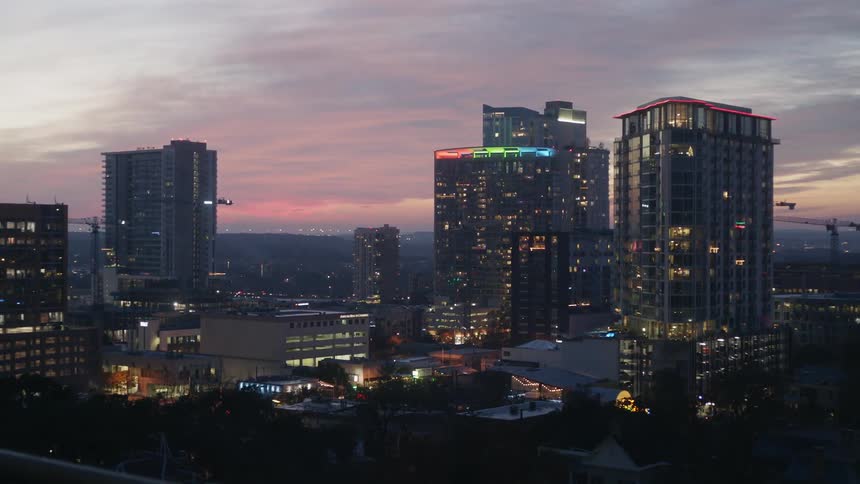 City lights glow at sunset