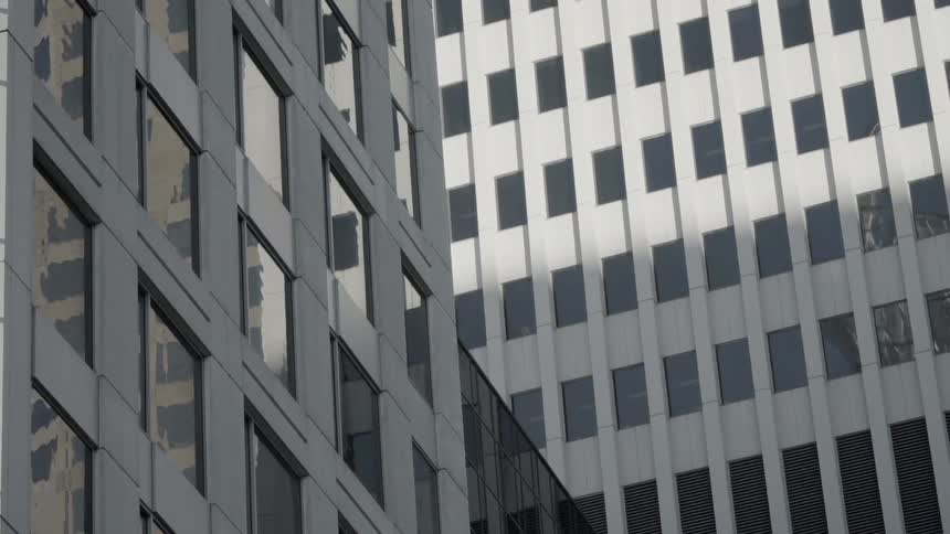 Windows cover a tall city building
