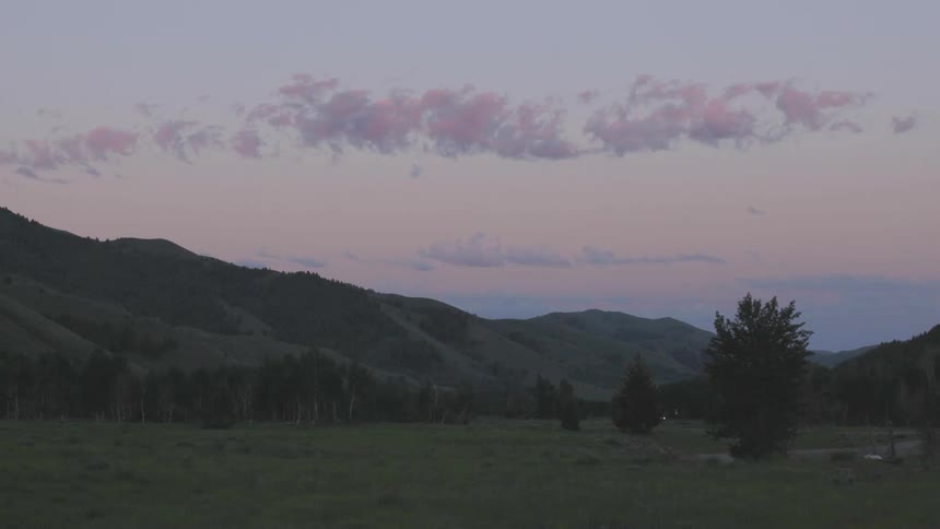 Clouds passing over a mountain