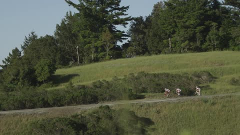 People riding bikes down a trail