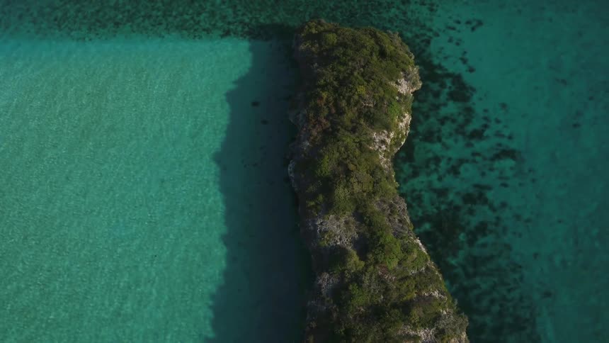 An island sits in the ocean