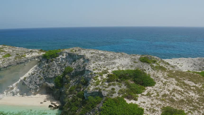 Ocean water flows towards an island