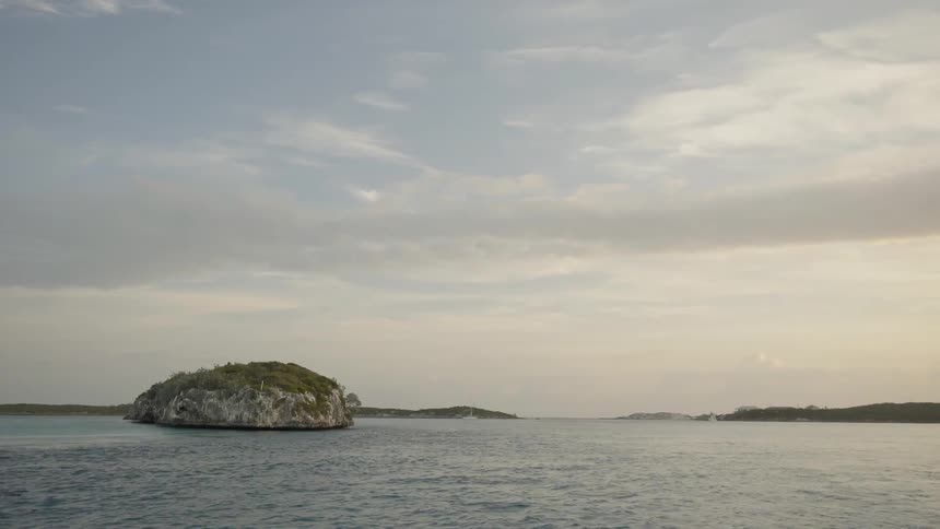 Ocean water flows by an island