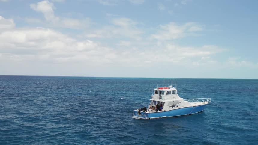 A boat sails on the open ocean
