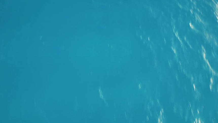 Turquoise water ripples on the ocean