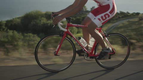 A man bikes in the country