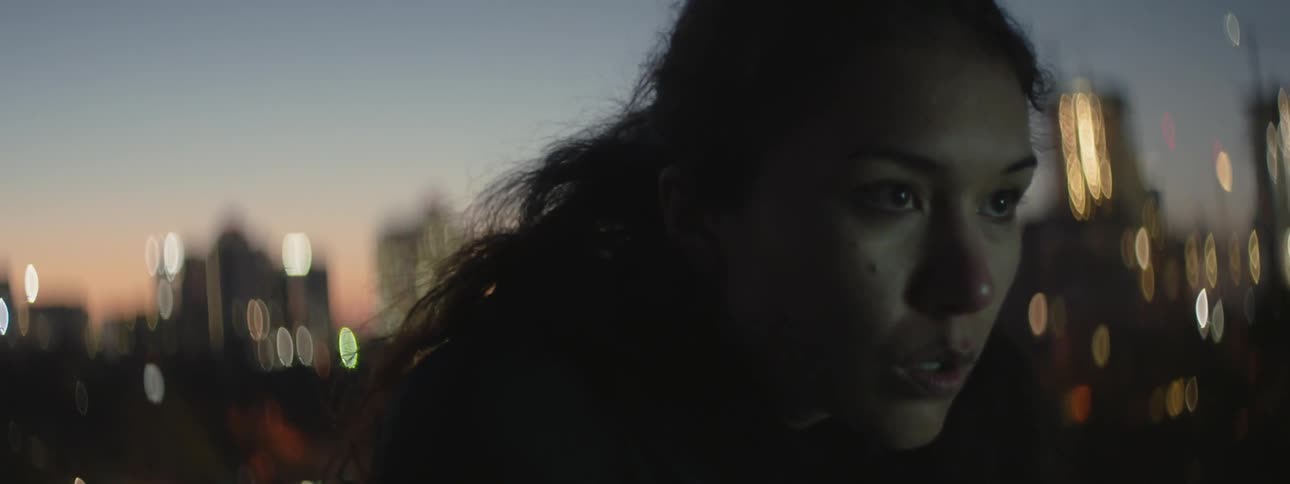 A woman bends over and catches her breath