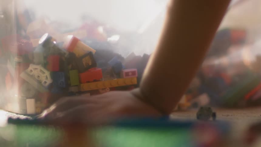 A child plays with toy building blocks