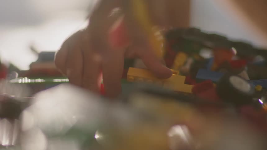 A child plays with toy building blocks