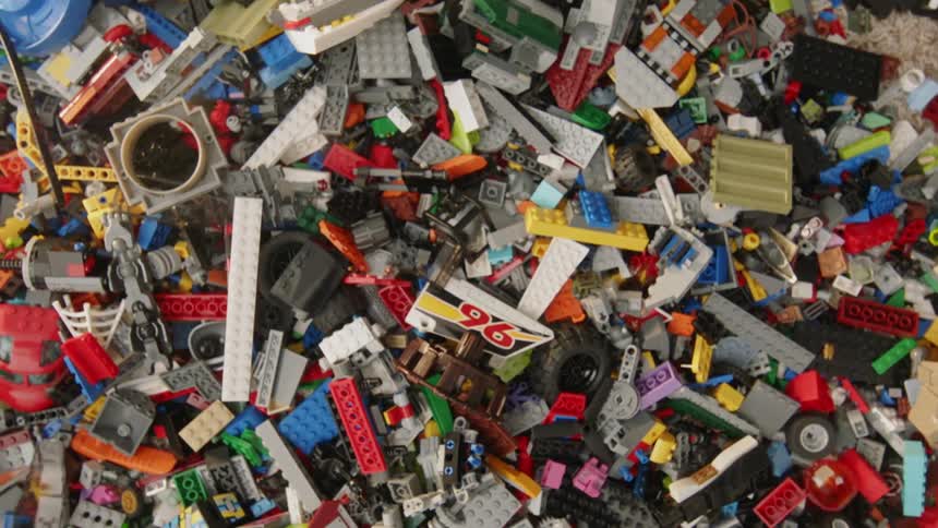 Toy building blocks are thrown into a pile