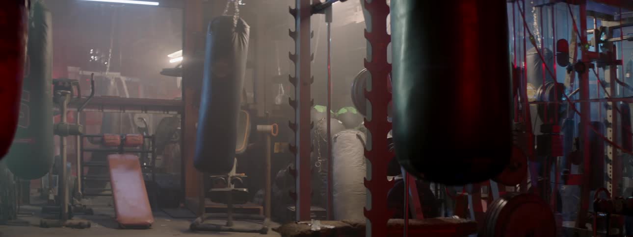 A punching bag swings in a gym