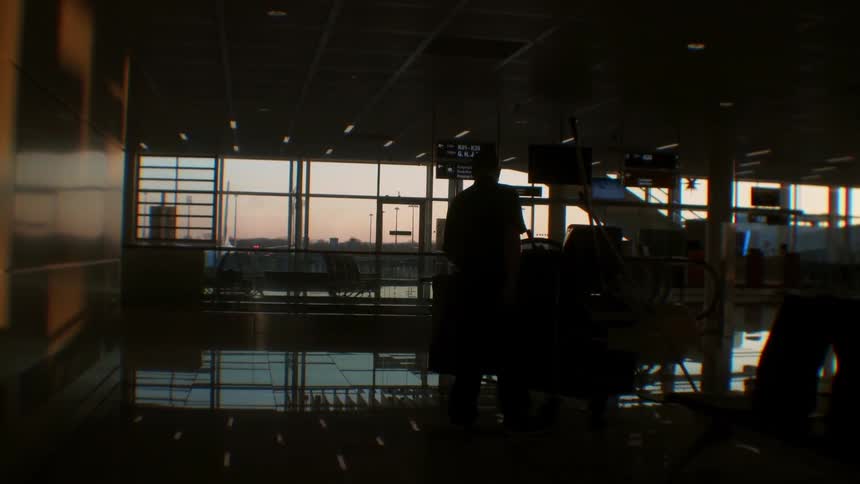 A man cleans the floor of an airport