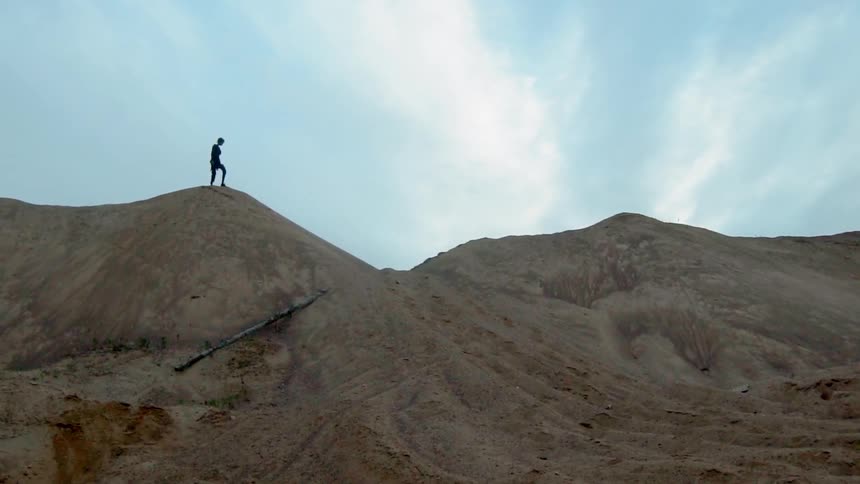 A person is hiking at the top of the mountain