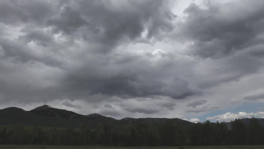 Ominous clouds float over a mountain