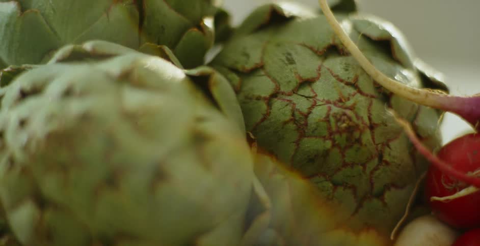 Three artichokes and some radishes