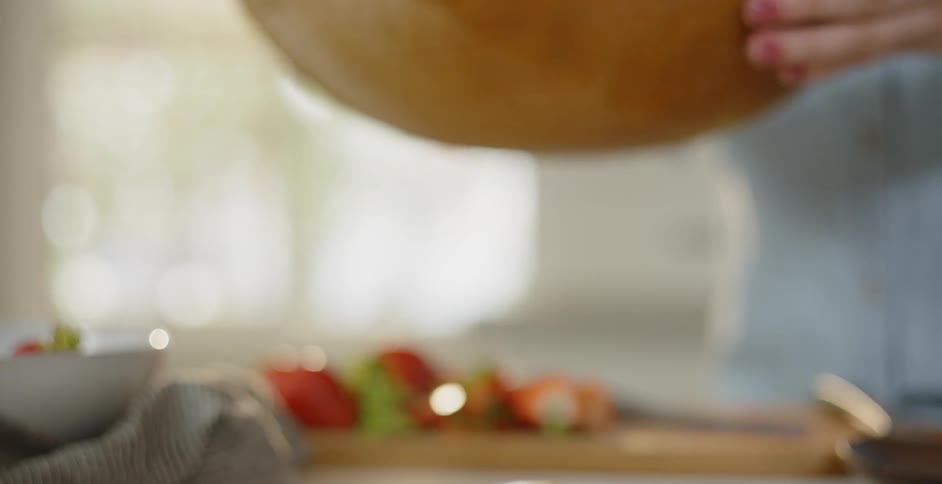A salad is prepared in a wood bowl