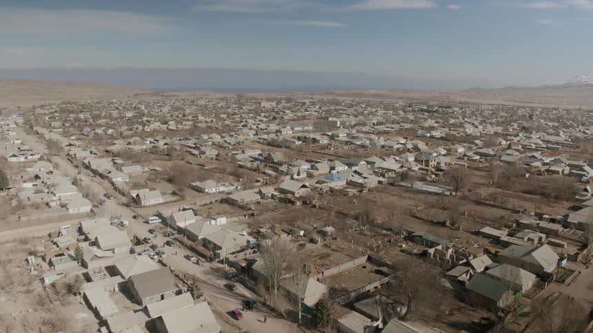 A neighborhood in the desert is viewed from the air