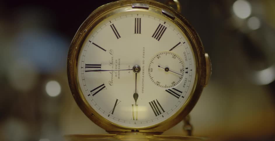 The seconds hand on a pocket watch is ticking