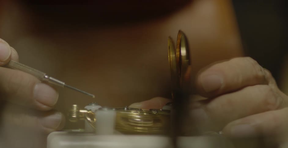 A man repairs a pocket watch