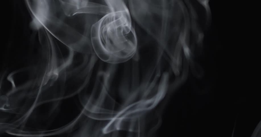 White smoke bellows into the air