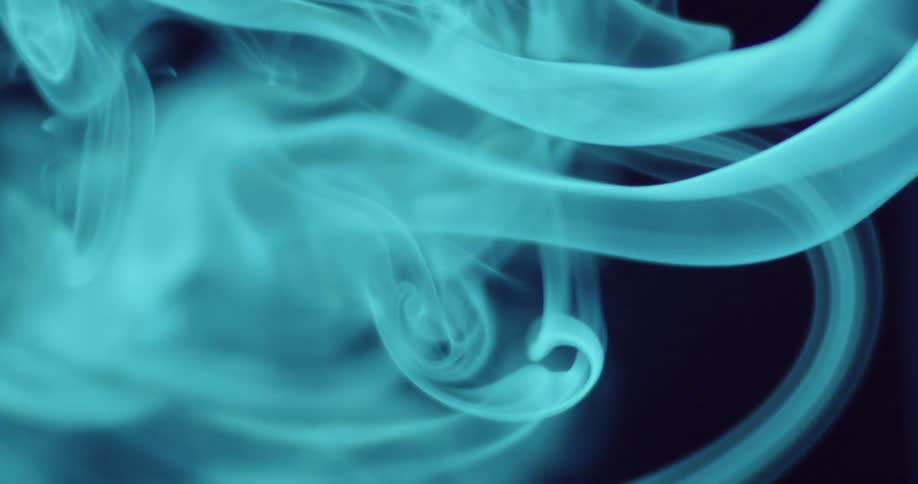 Smoke curls across a dark background
