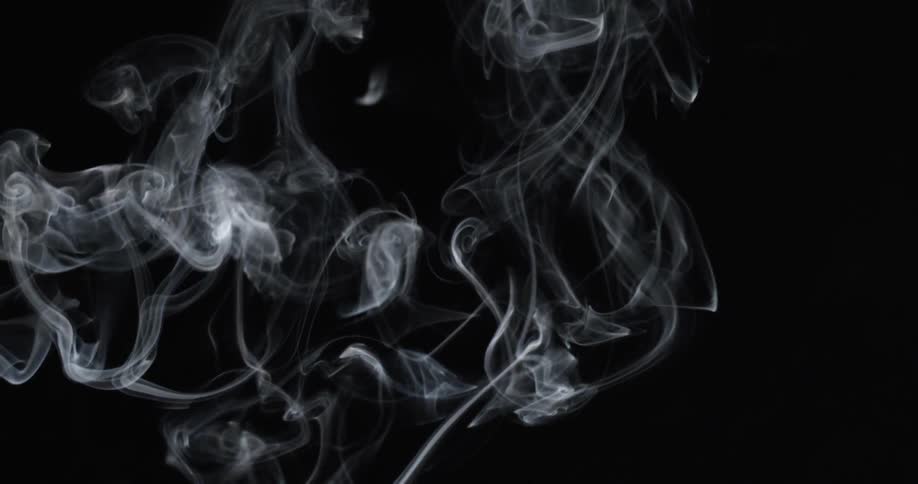 White smoke swirls and rises against black