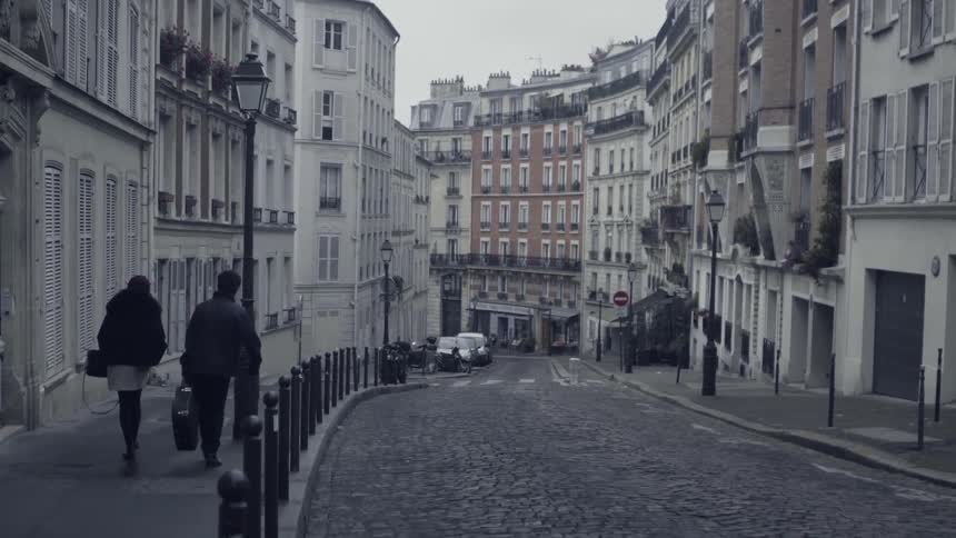 A narrow city street lined with old buildings