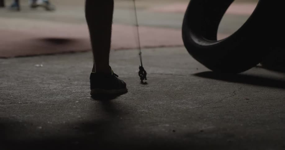 Person pulls a rope anchored to the ground