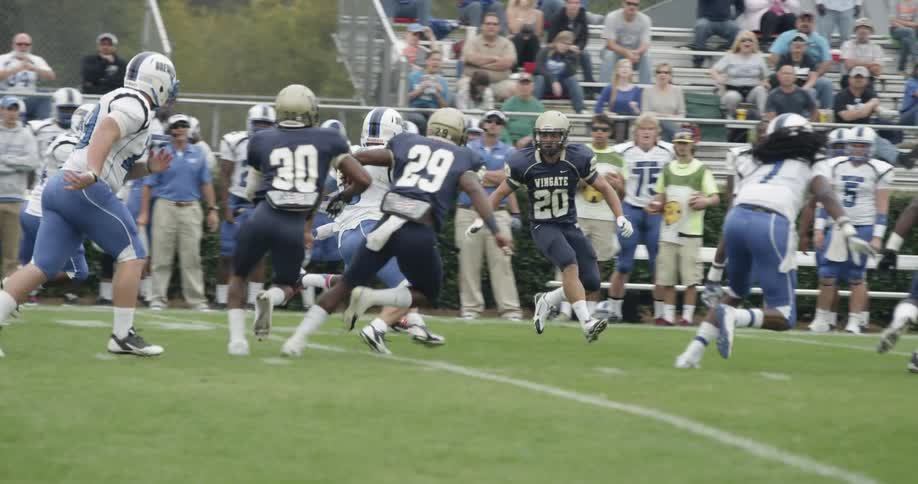 Two football teams play on the field