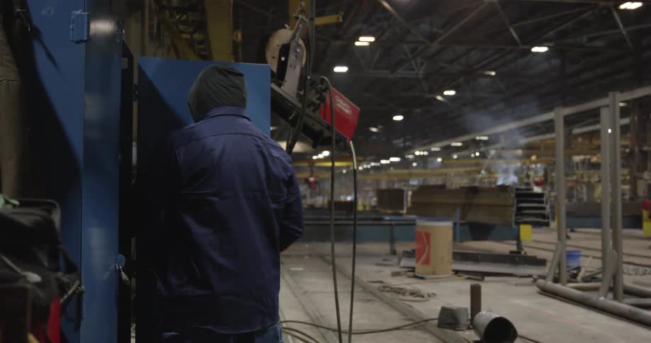A man works in a factory